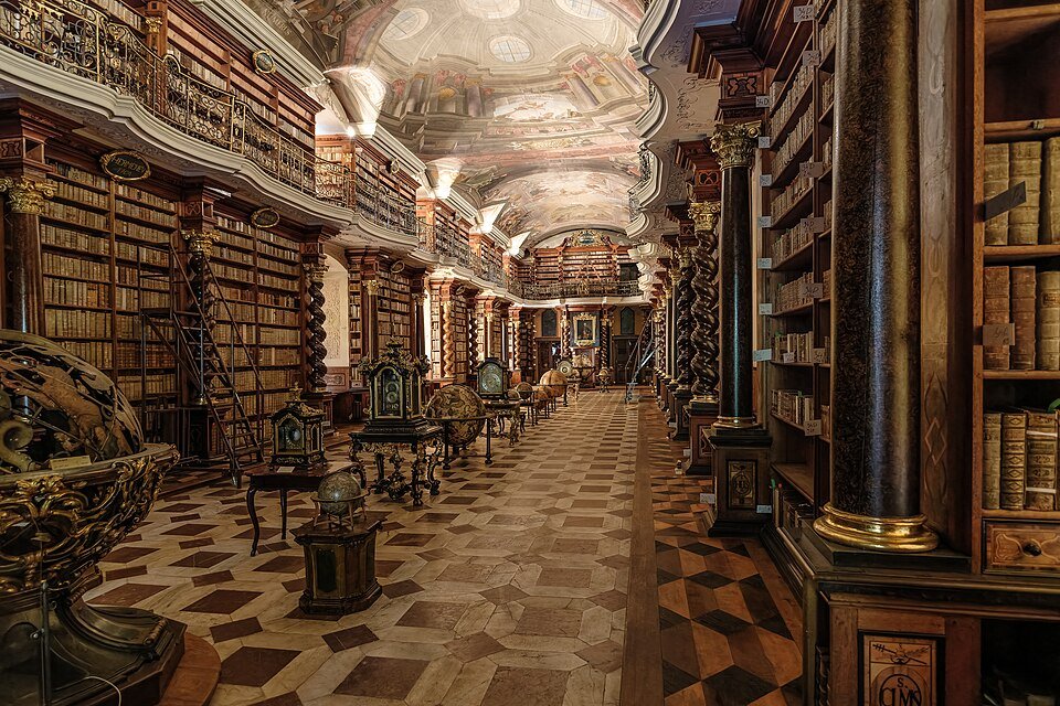 The Baroque Library Hall of the Clementinum in Prague, with its frescoed ceiling and gilded bookcases